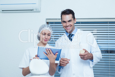 Dentists using digital tablet