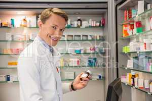 Handsome pharmacist using the computer