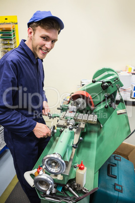 Engineering student using heavy machinery