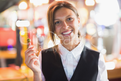 Pretty barmaid smiling at camera