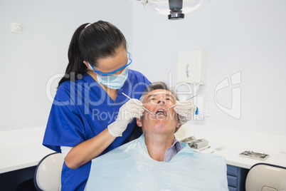 Dentist examining a patient