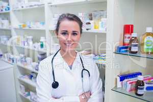 Student in lab coat with stethoscope and arms crossed