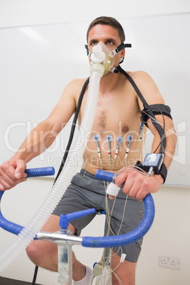 Man doing fitness test on exercise bike