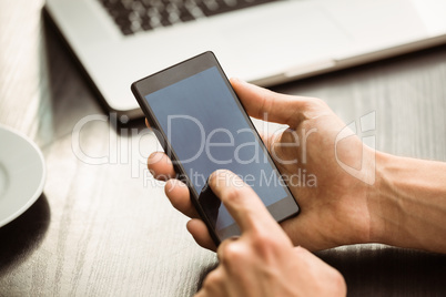 Student touching his mobile phone