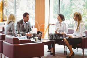 Business people talking and working together on sofa