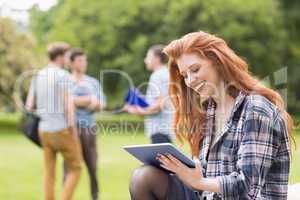 Pretty student studying outside on campus