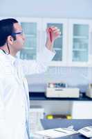 Science student holding up vial