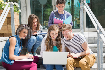 Students sitting on steps studying