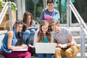 Students sitting on steps studying