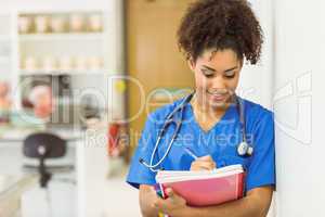 Young medical student taking notes