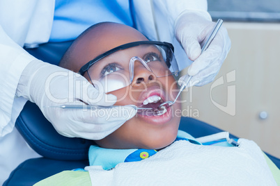 Close up of boy having his teeth examined