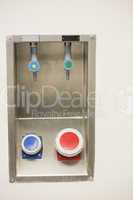 Blue and red buttons on the wall