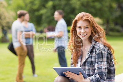 Pretty student studying outside on campus