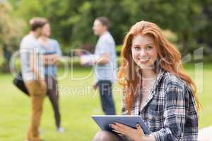 Pretty student studying outside on campus