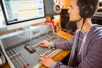 Portrait of an university student mixing audio