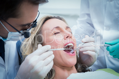 Close up of woman having her teeth examined