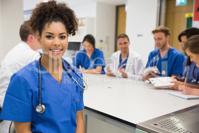 Medical student smiling at the camera during class