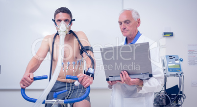 Man doing fitness test on exercise bike