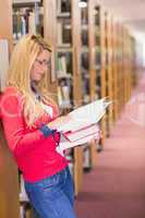 Mature student reading in library