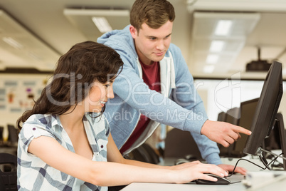 Classmates working together in the computer room