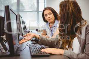 Businesswomen looking at computer screen together