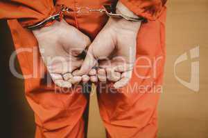 Hands of criminal with handcuffs