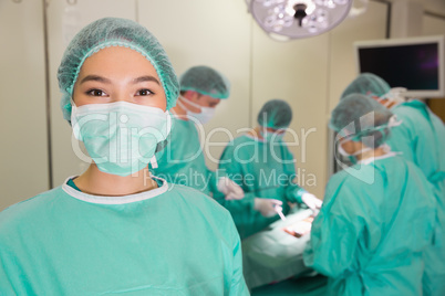 Medical students practicing surgery on model