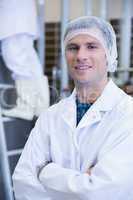 Portrait of a smiling scientist with arms crossed