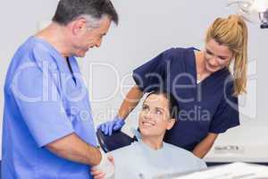 Dentist and nurse introducing a patient