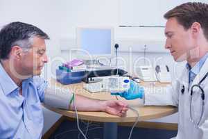 Doctor talking to his patient about his blood pressure