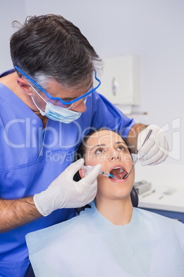 Dentist doing injection to his patient