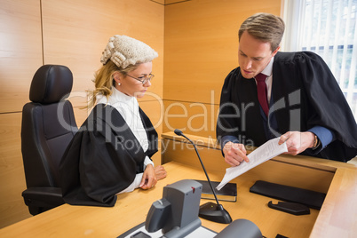 Lawyer speaking with the judge