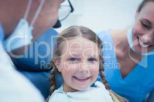 Close up portrait of girl having her teeth examined