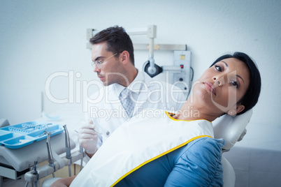 Serious woman waiting for dental exam