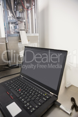 Laptop on desk with blank screen