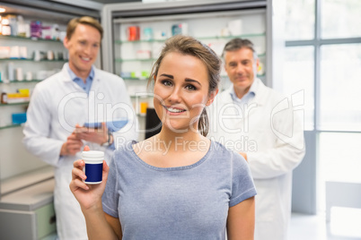 Happy customer holding her medicine