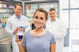Happy customer holding her medicine