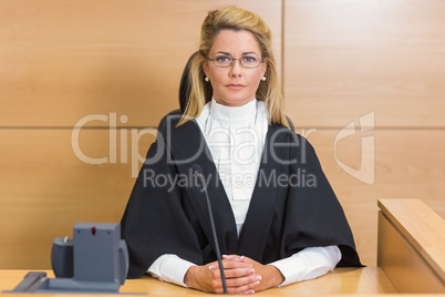 Stern judge looking at camera