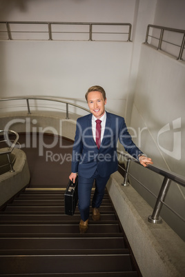 Businessman going up the stairs