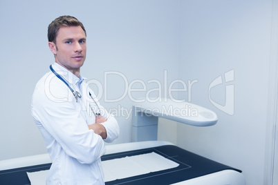 Confident male doctor with arms crossed