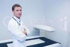 Confident male doctor with arms crossed