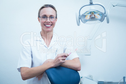 Smiling young female dentist