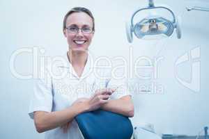 Smiling young female dentist