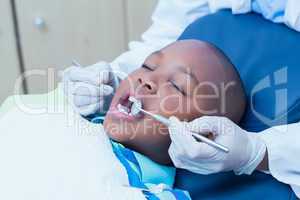 Close up of boy having his teeth examined