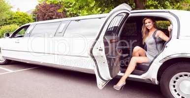 Beautiful blonde stepping out of limousine