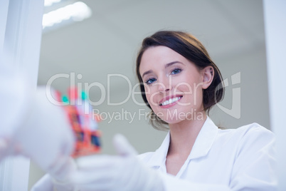 Young female biologist smiling at the camera