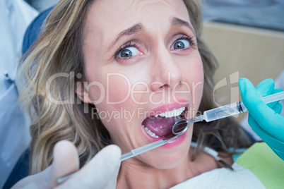 Close up of woman having her teeth examined