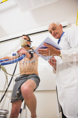 Man doing fitness test on exercise bike