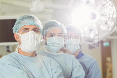 Team of surgeons looking at camera