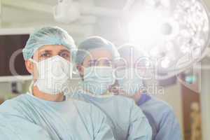 Team of surgeons looking at camera